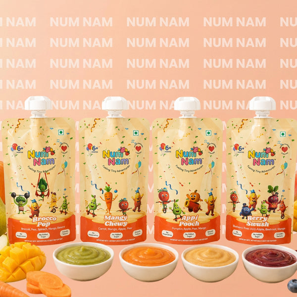 Four pouches of Num Num Nam baby food in flavors Appi pooch, Brocco Pop, Mangy chewy, Berry swush, displayed with five small bowls of colorful puree in front on a peach background with the brand name repeated.