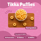 Bowl of Tikka Puffies baked millet puff rings on a wooden board — Real Ingredients, No Preservatives, No Additives, No MSG